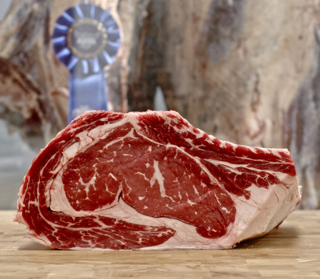 Beautiful shot of an Alberta Prime Rib from the side, showcasing its marbling.