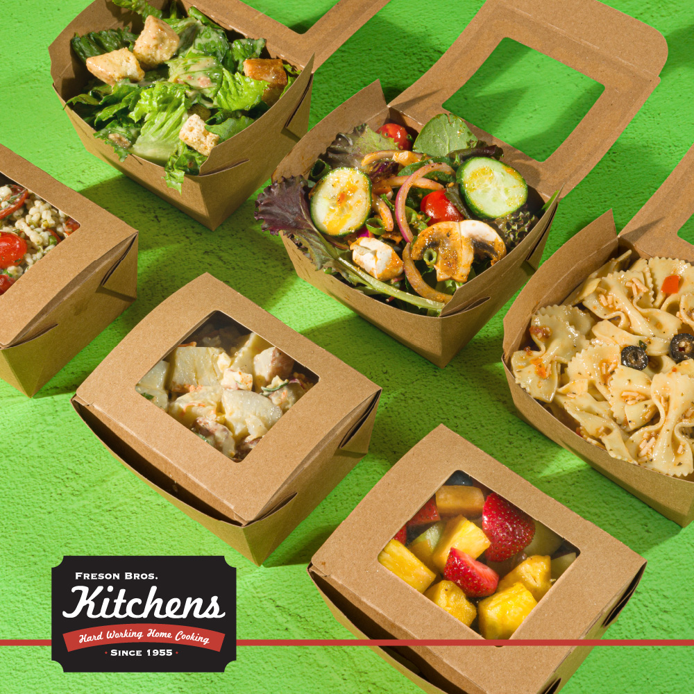 6 boxes of side salads, filled with various salad options - from leafy greens to pasta salads - now available with every combo meal from Freson Bros. Fresh Market Kitchens