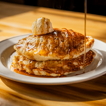 Our Sourdough Pancakes are made fresh! Super fluffy and topped with delicious whipped butter and syrup, they’re a must try!