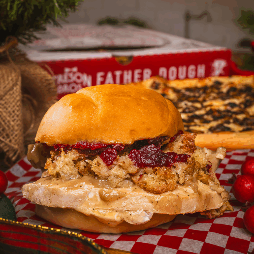 It's Back! Dive into comfort this winter with our December to Remember Sandwich! Mike's Meals December to Remember is like Christmas dinner on a sandwich. Cranberry sauce, savoury stuffing, gravy, and turkey on an Kaiser Bun. Go gourmet with the rich, luxurious Truffled Mushroom Pizza. Only here for December!