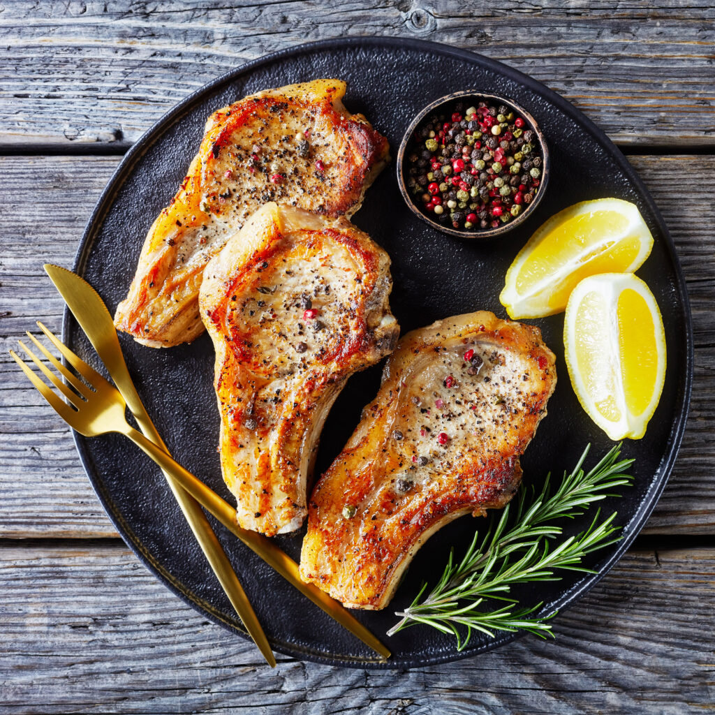 Enjoy juicy Marinated Pork Chops made with local Alberta Pork. A simple lemon and herb marinade makes this an affordable and delicious home-cooked meal!